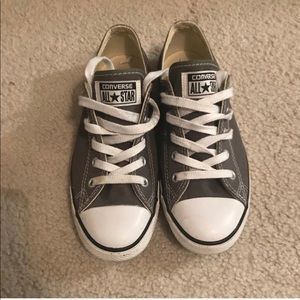 Woman’s gray low-top Converse